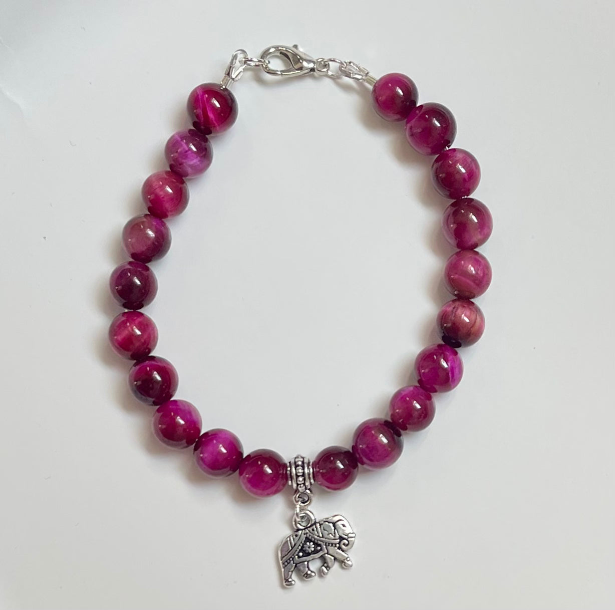 Magenta Tiger Eye gemstone bracelet with lotus charm