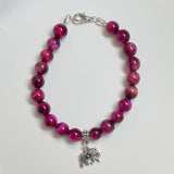 Magenta Tiger Eye gemstone bracelet with lotus charm