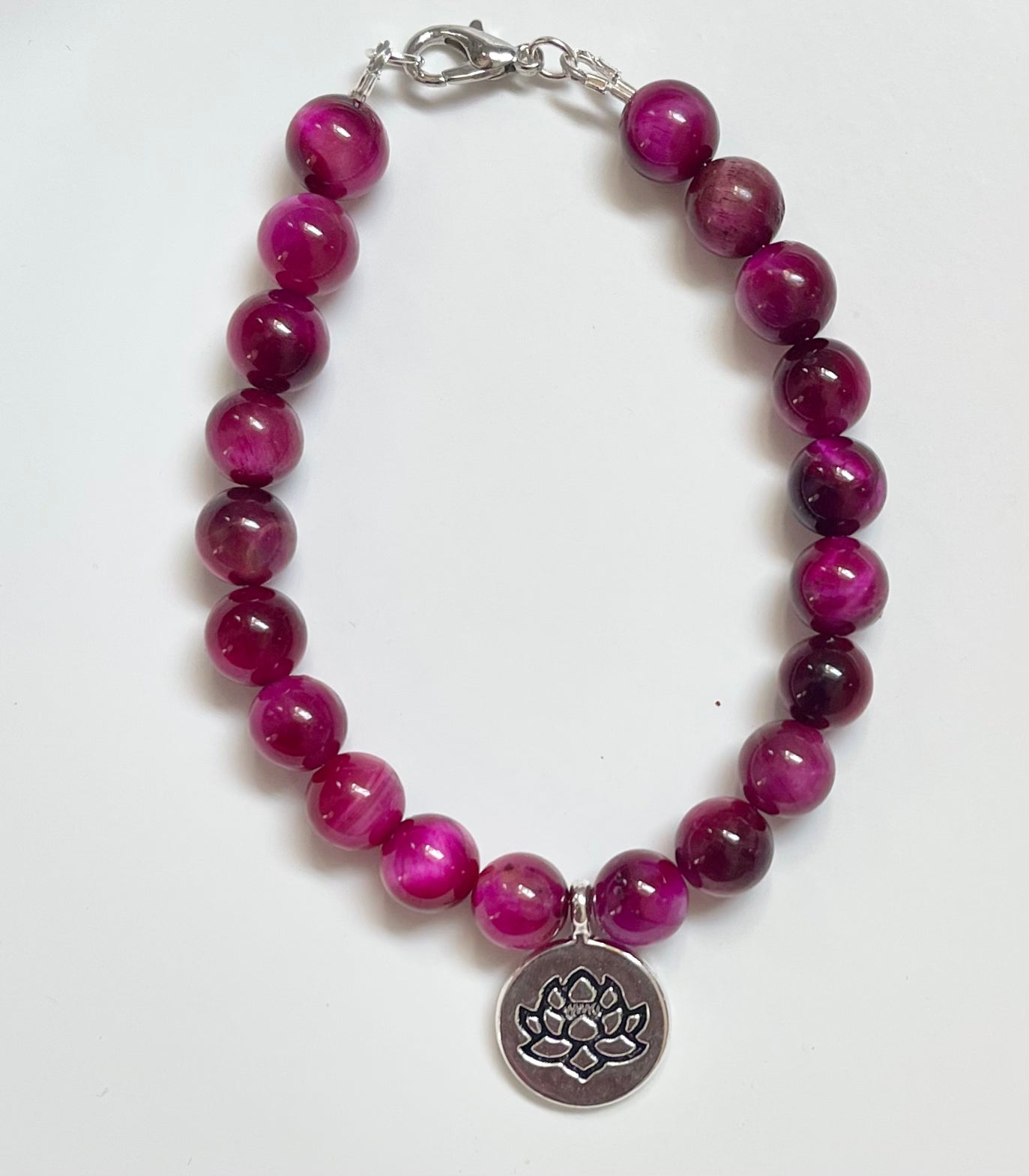 Magenta Tiger Eye gemstone bracelet with lotus charm