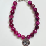 Magenta Tiger Eye gemstone bracelet with lotus charm