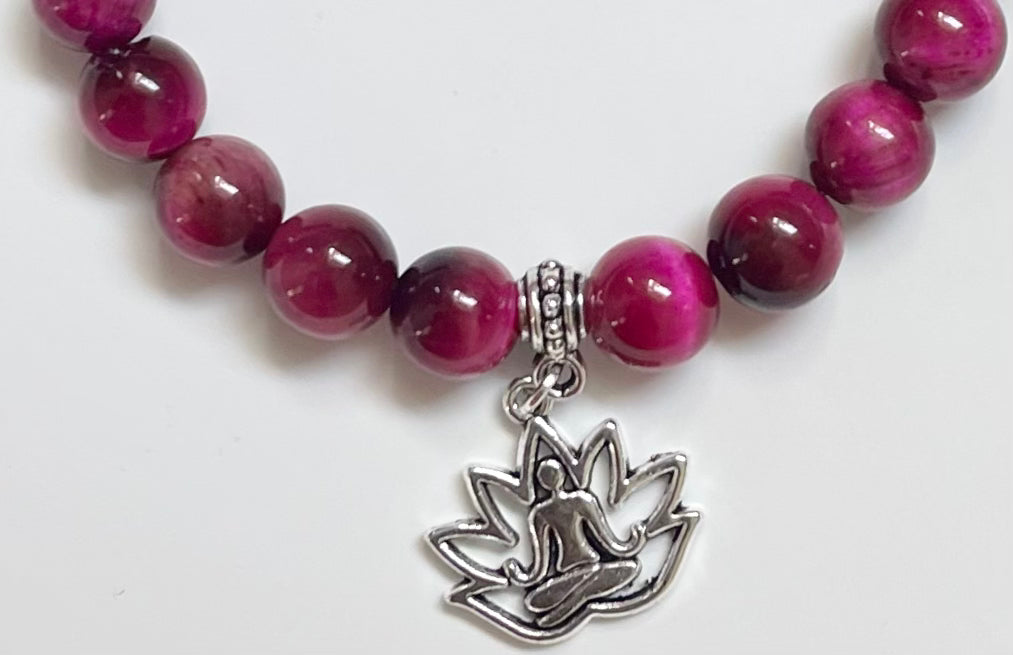 Close-up of magenta tiger eye beads jewelry