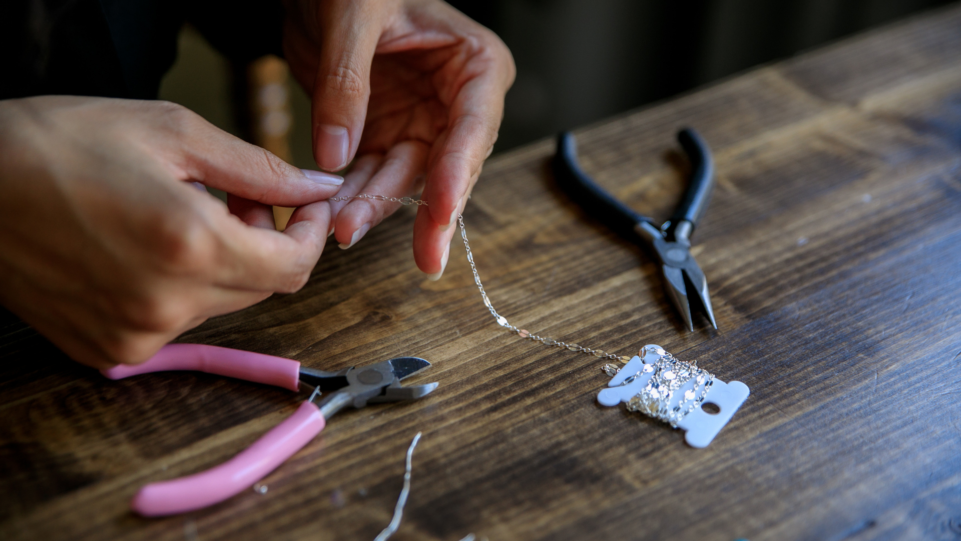 person making jewelry 