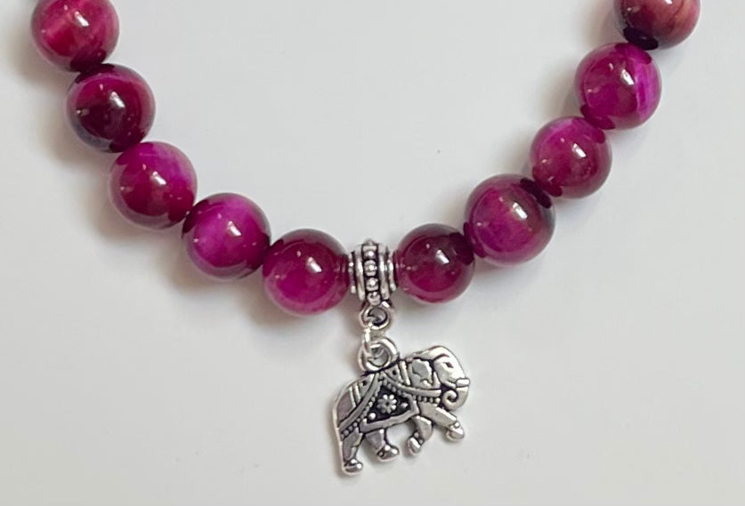 Close-up of magenta tiger eye beads jewelry